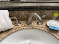 Faucett not secured to countertop.