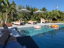 Back yard pool and lounge chairs