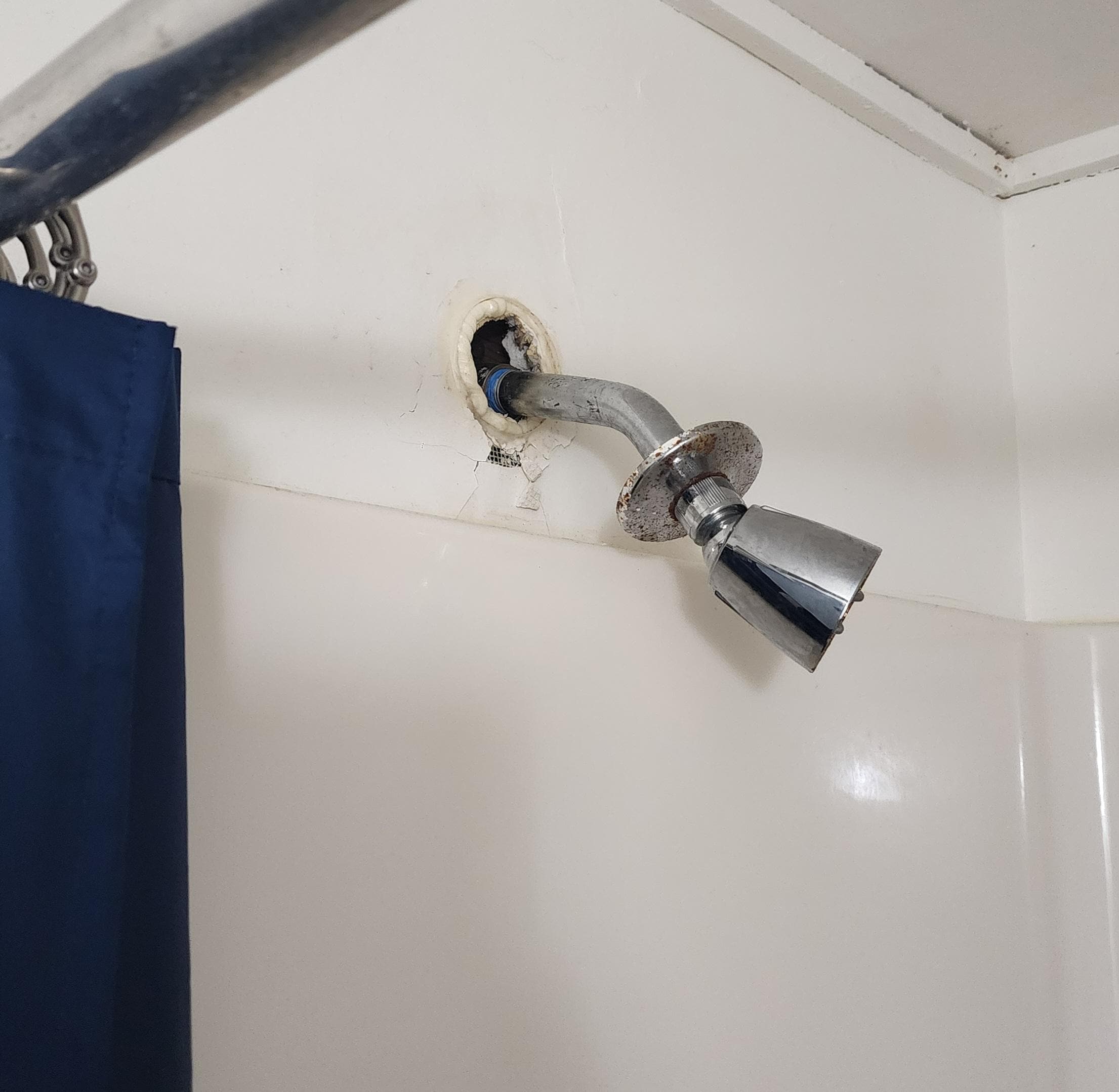 Broken showerhead and barely any water pressure.  