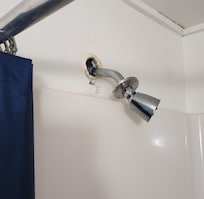 Broken showerhead and barely any water pressure.