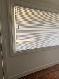 Broken blinds in kitchen