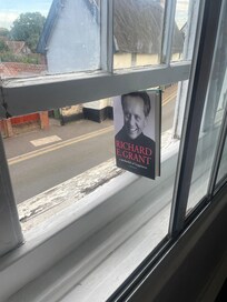 Window wedged open with a book