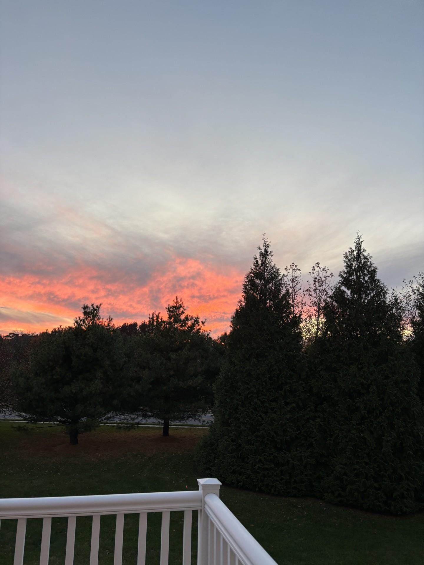 Our sunset view from the rear deck (and primary suite upstairs).