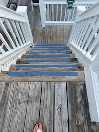Flight of stairs right outside of 115