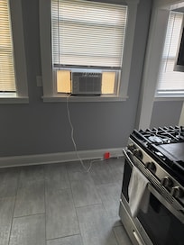 bare bedroom with window ac unit. Not like an oasis as described!