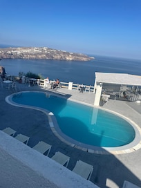 Hotel pool overlooking caldera