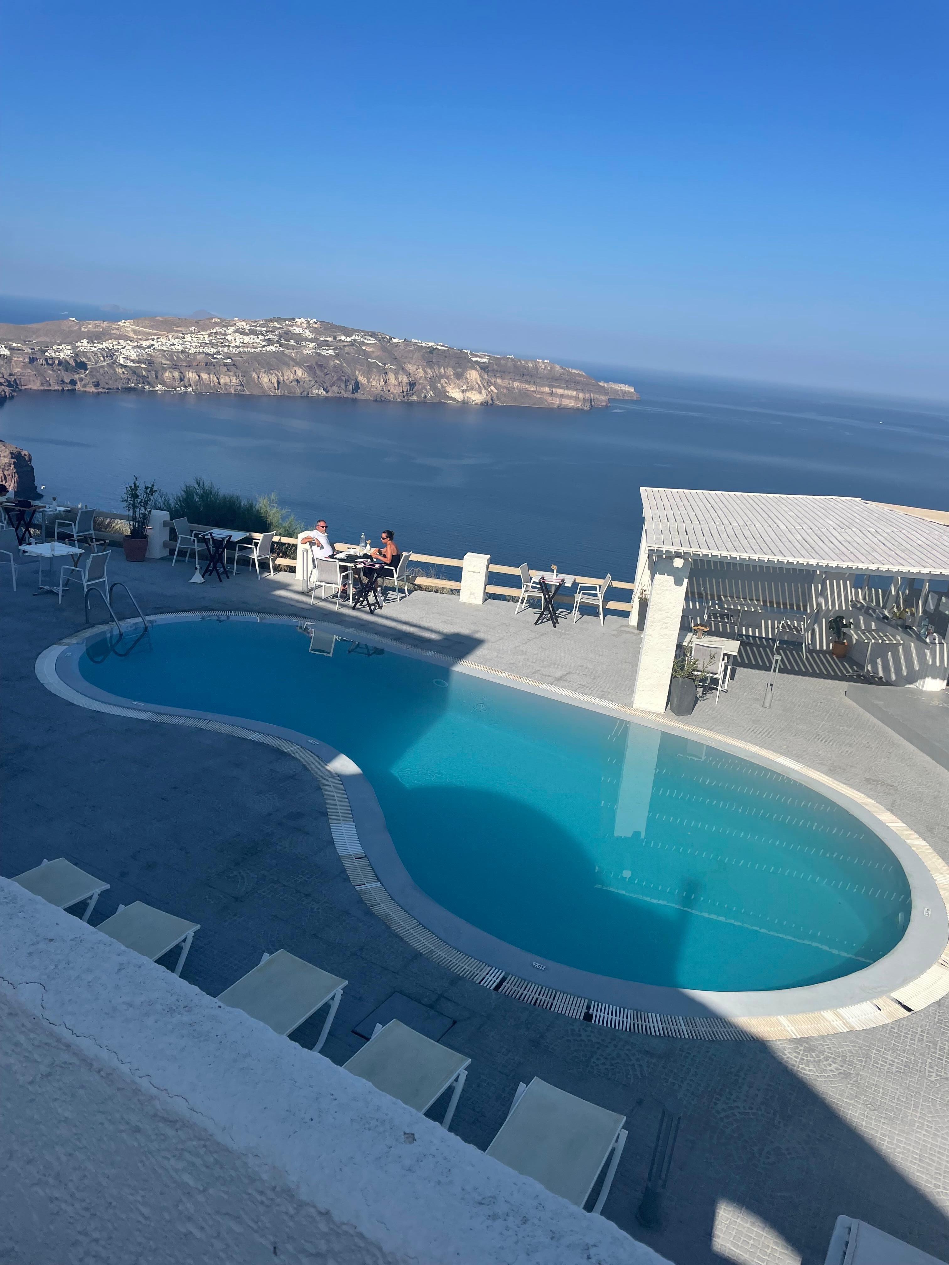 Hotel pool overlooking caldera