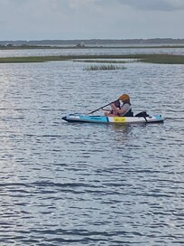 Kayaking in front of house