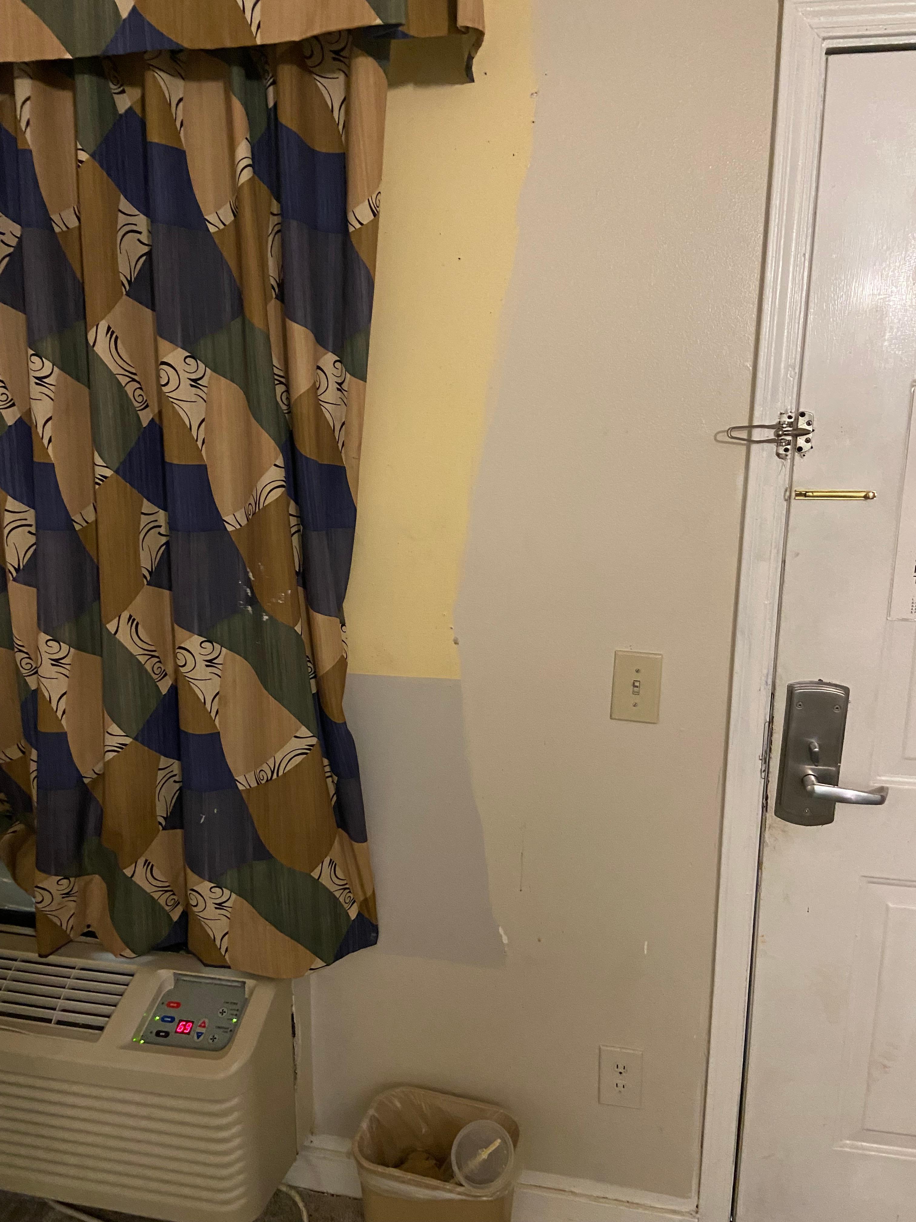 Multiple colors of paint on the walls