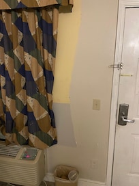 Multiple colors of paint on the walls