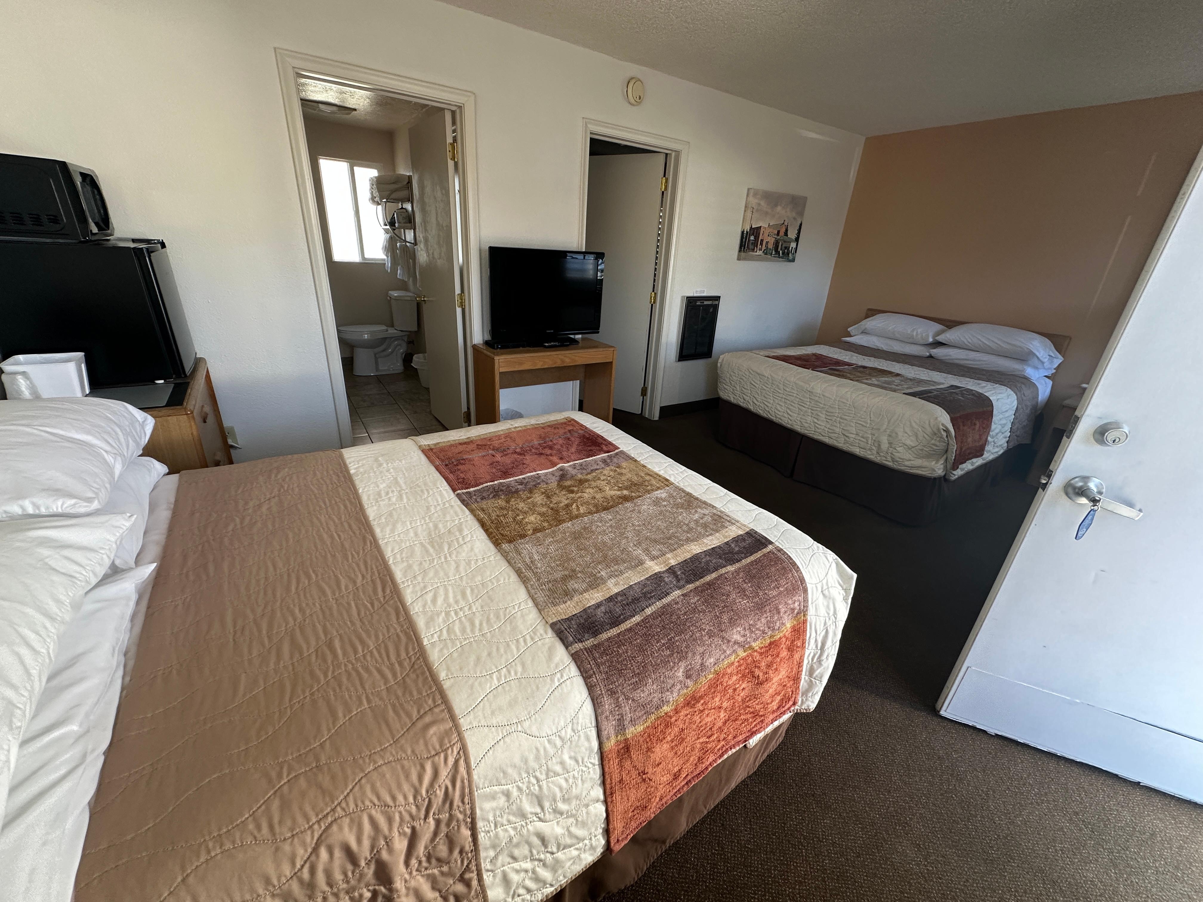 Family room with 3 beds. 