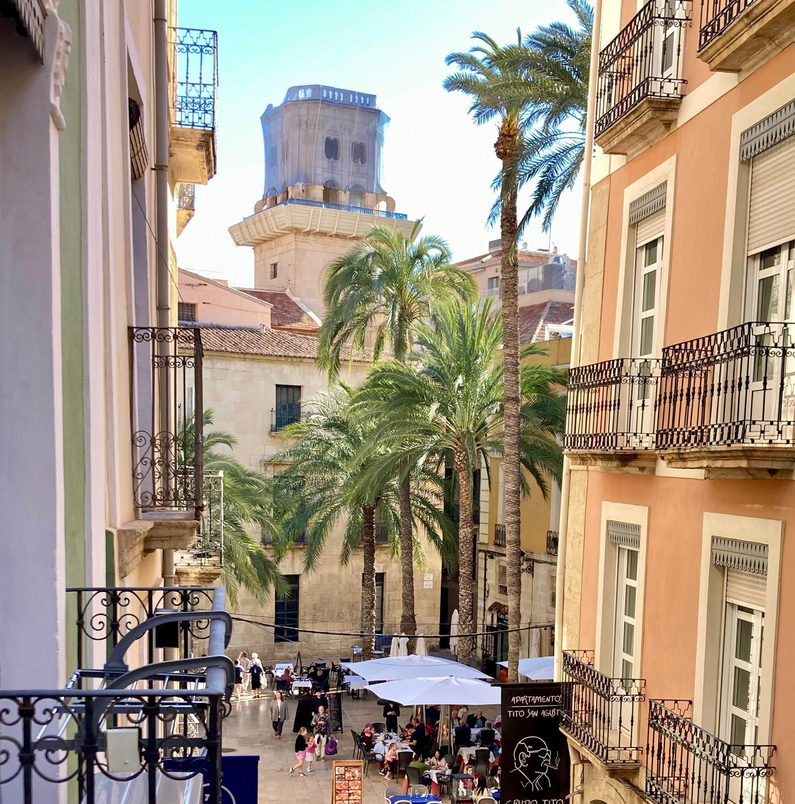 View from hotel balcony to a lovely square for eats & drinks c200m