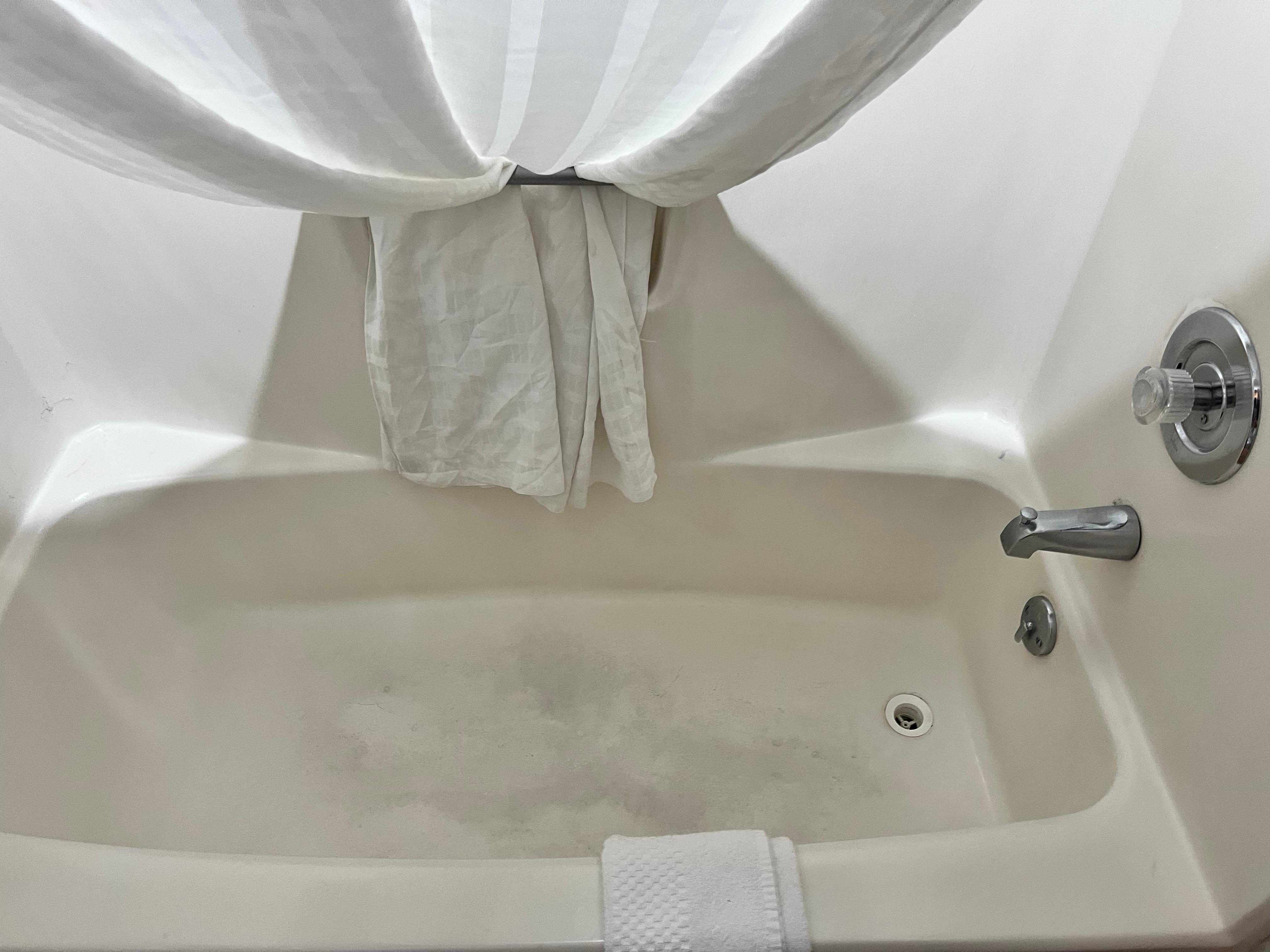 Bathtub full of stains.