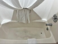 Bathtub full of stains.