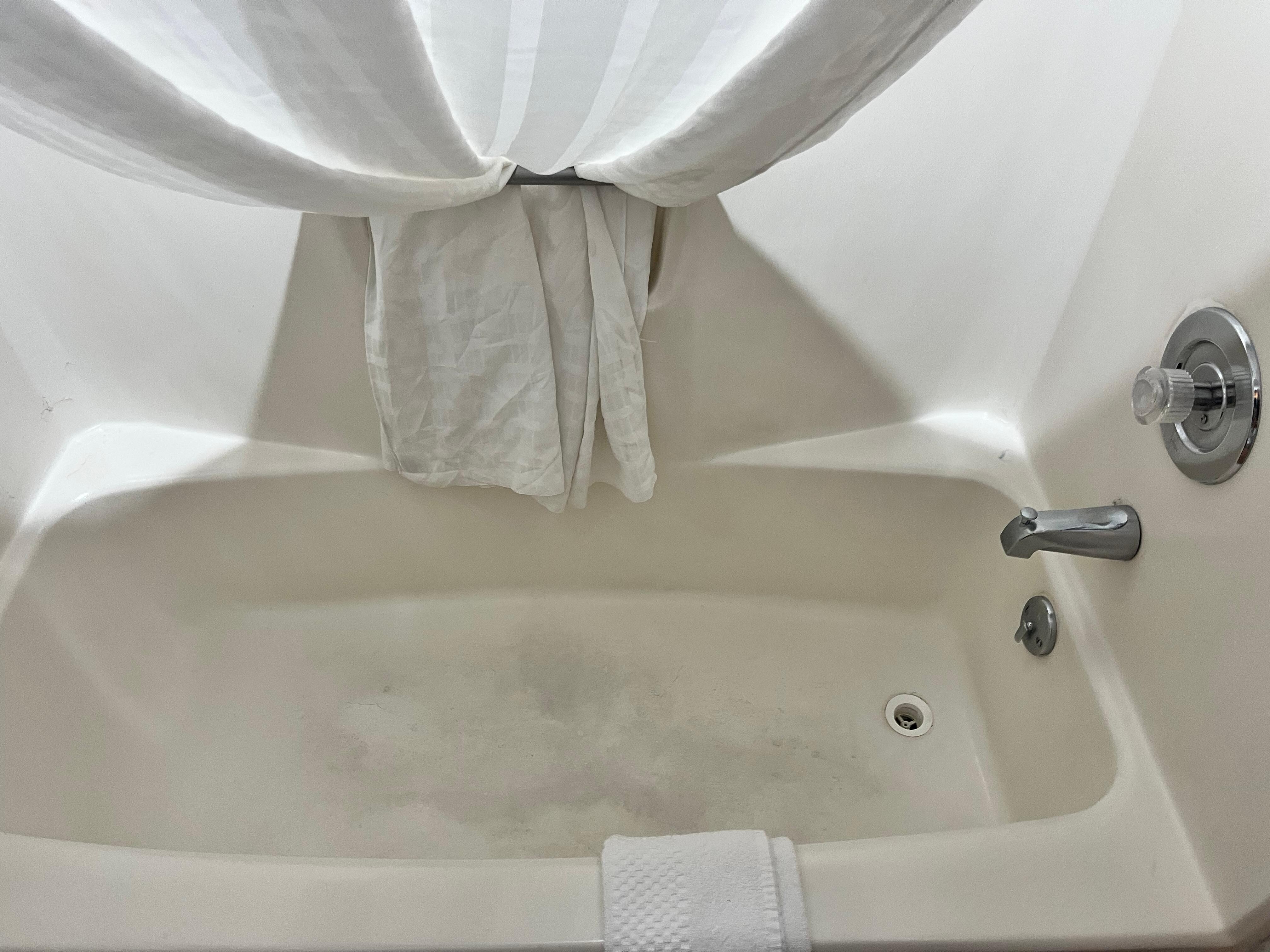 Bathtub full of stains.