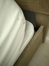 Dirty sheets on the beds.