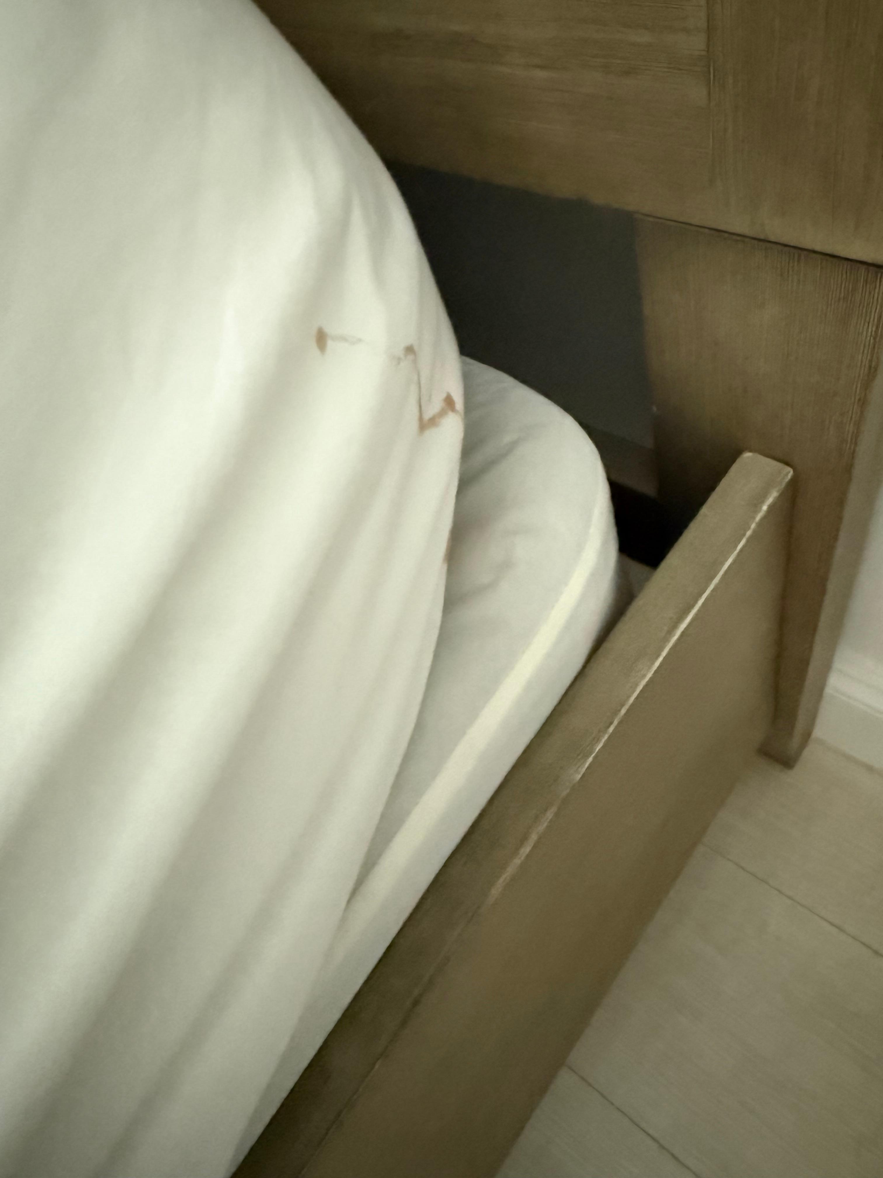 Dirty sheets on the beds.