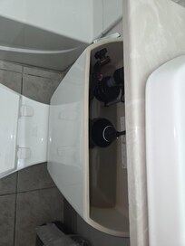 Toilet with broken chain. The only way it could be flushed was to take the lid off and pull the thing in the middle up.