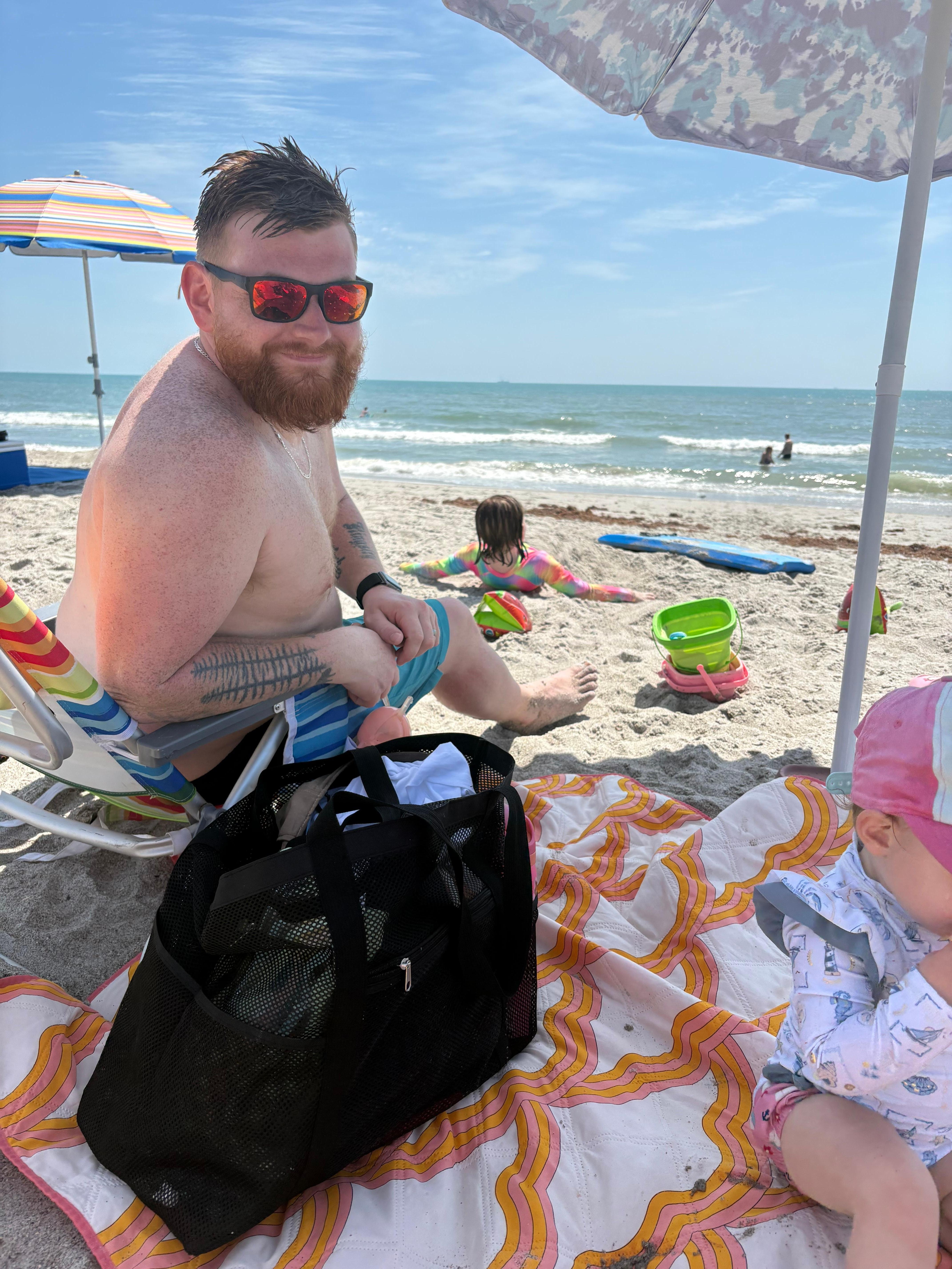 Son in law enjoying the ocean first time! Using owner’s beach umbrella, blanket, chairs & cooler. 