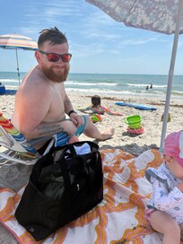 Son in law enjoying the ocean first time! Using owner’s beach umbrella, blanket, chairs & cooler.