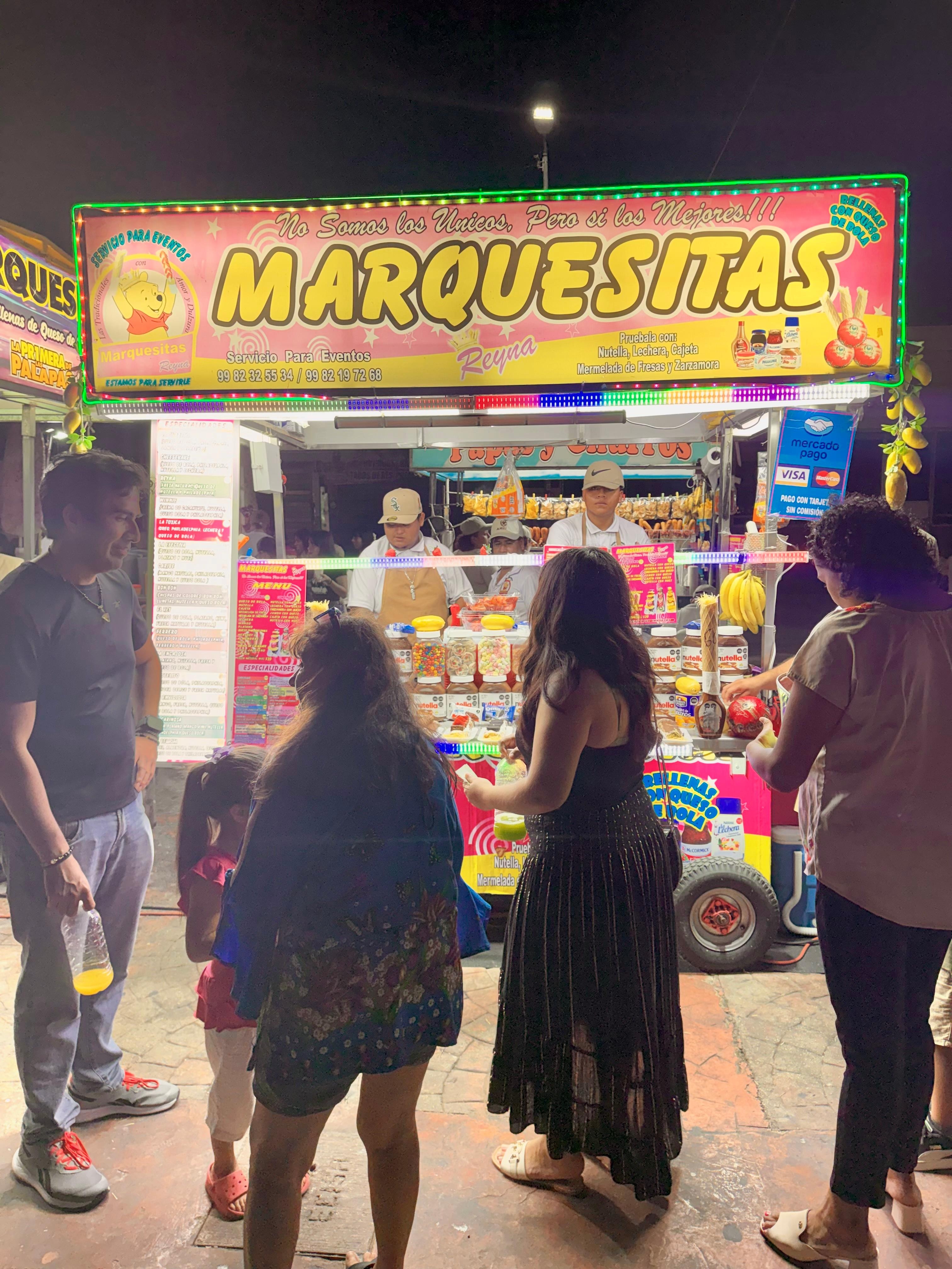 The park is full of families on Saturday night.