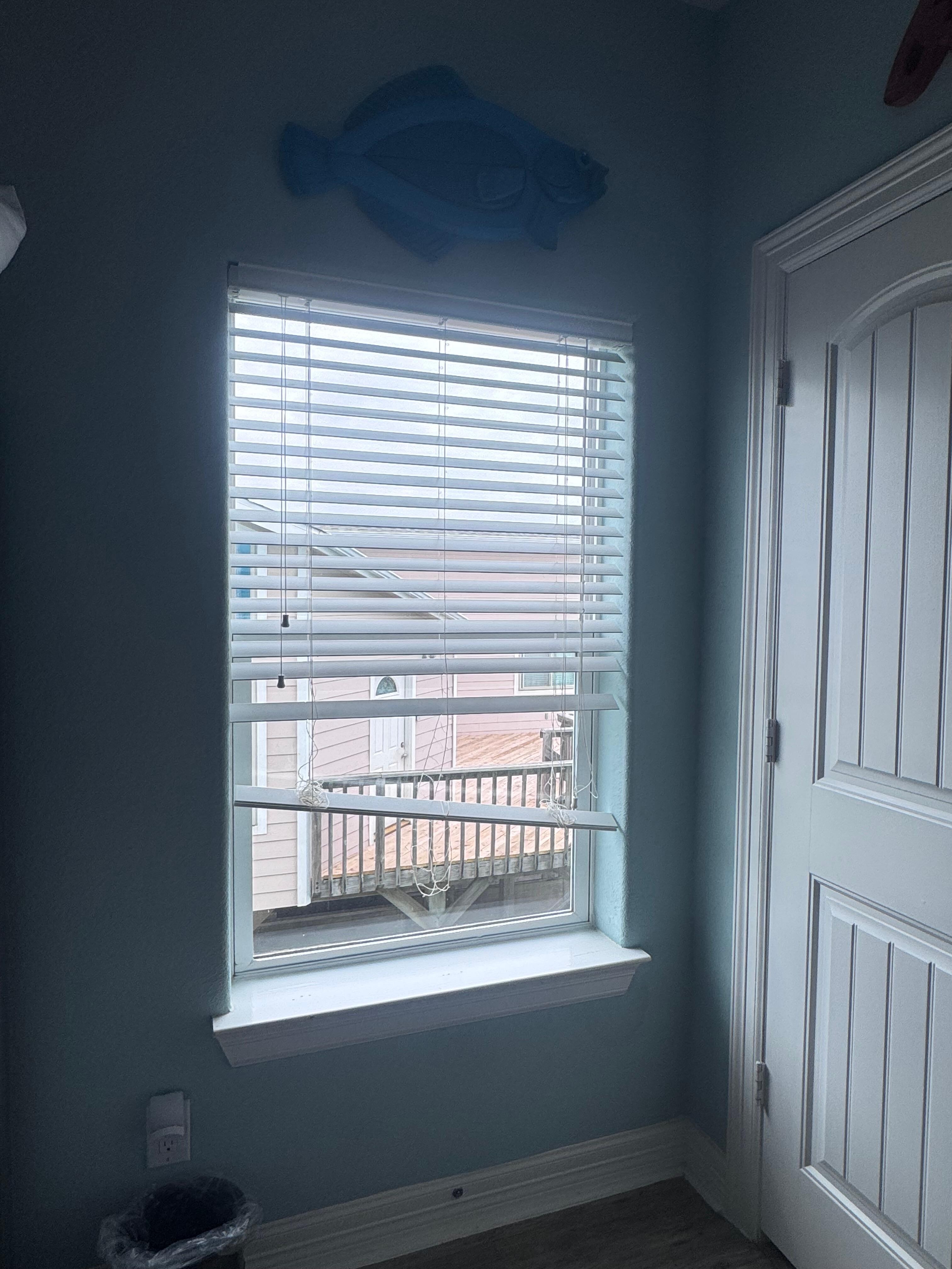Broken blinds in downstairs bunk bed room