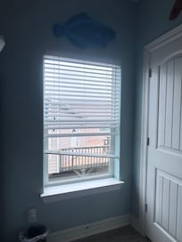 Broken blinds in downstairs bunk bed room