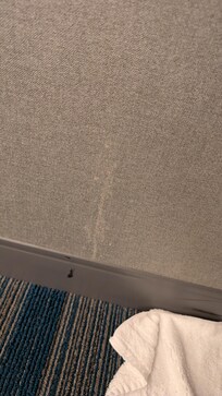 White stuff caked on the wall.