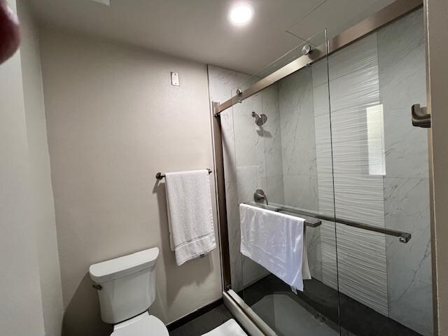 lack of design in bathroom, no shelf in shower, no shelf in bathroom, no trash can, no mirror, bad finishes