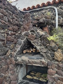 Barbecue pit on the side of the Casita