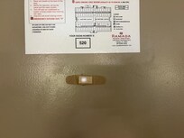 bandaid over peephole