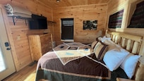 Spacious bedroom with access to one of two balconies.