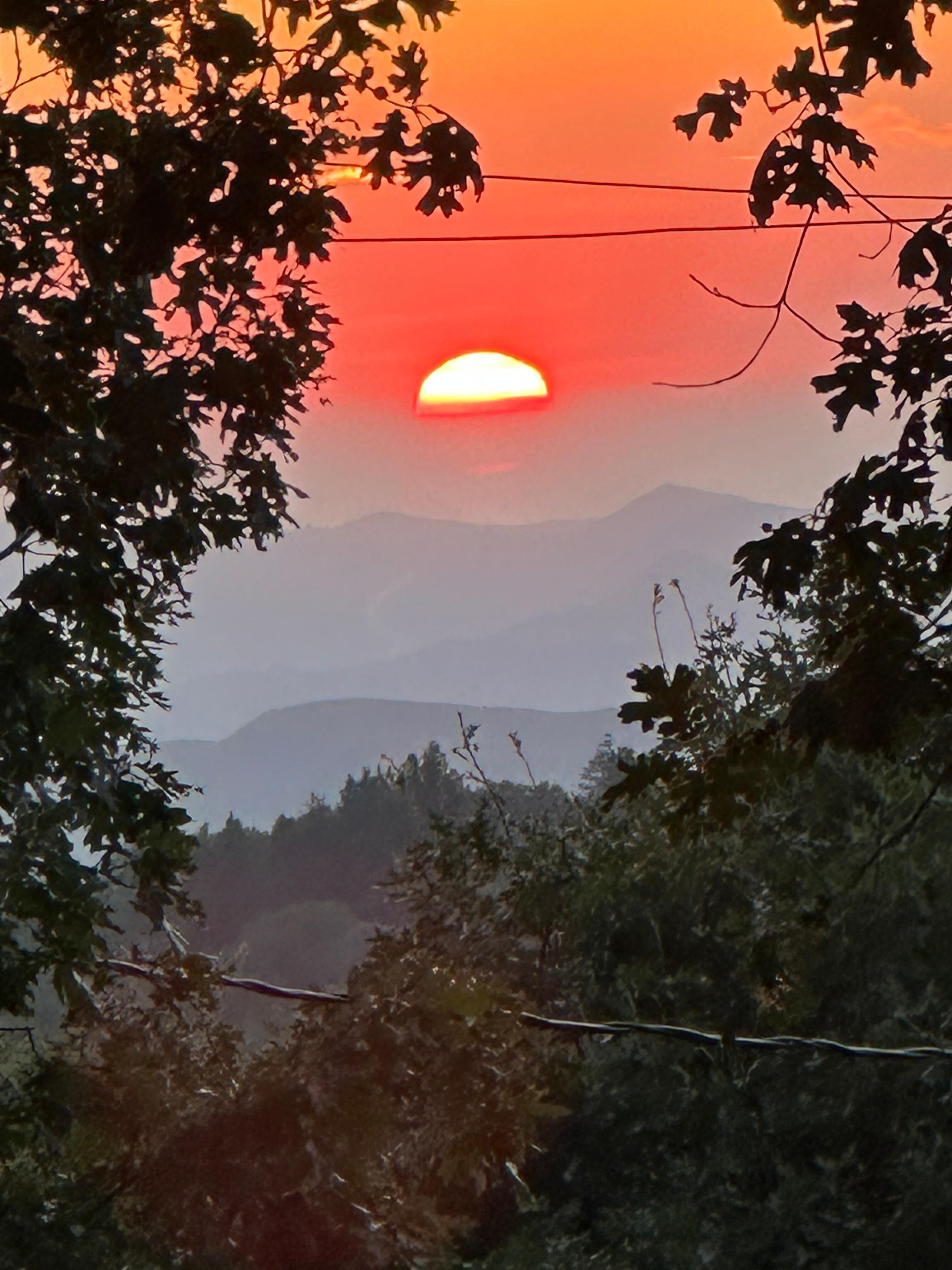 From the kitchen window at sunset in July. Incredible!