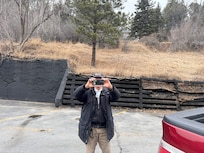 Crazy guy that films people in parking lot. Never speaks but chases vehicles and films women
