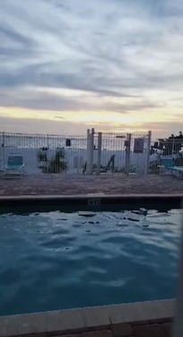 Enjoying a sunset by the pool