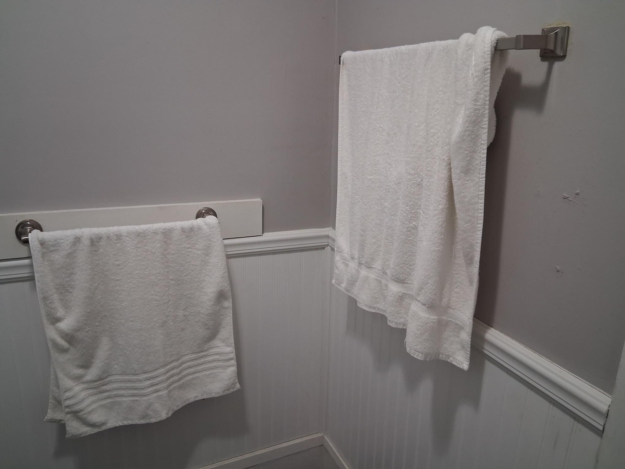 Dirty towels hanging in bathroom