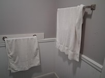 Dirty towels hanging in bathroom