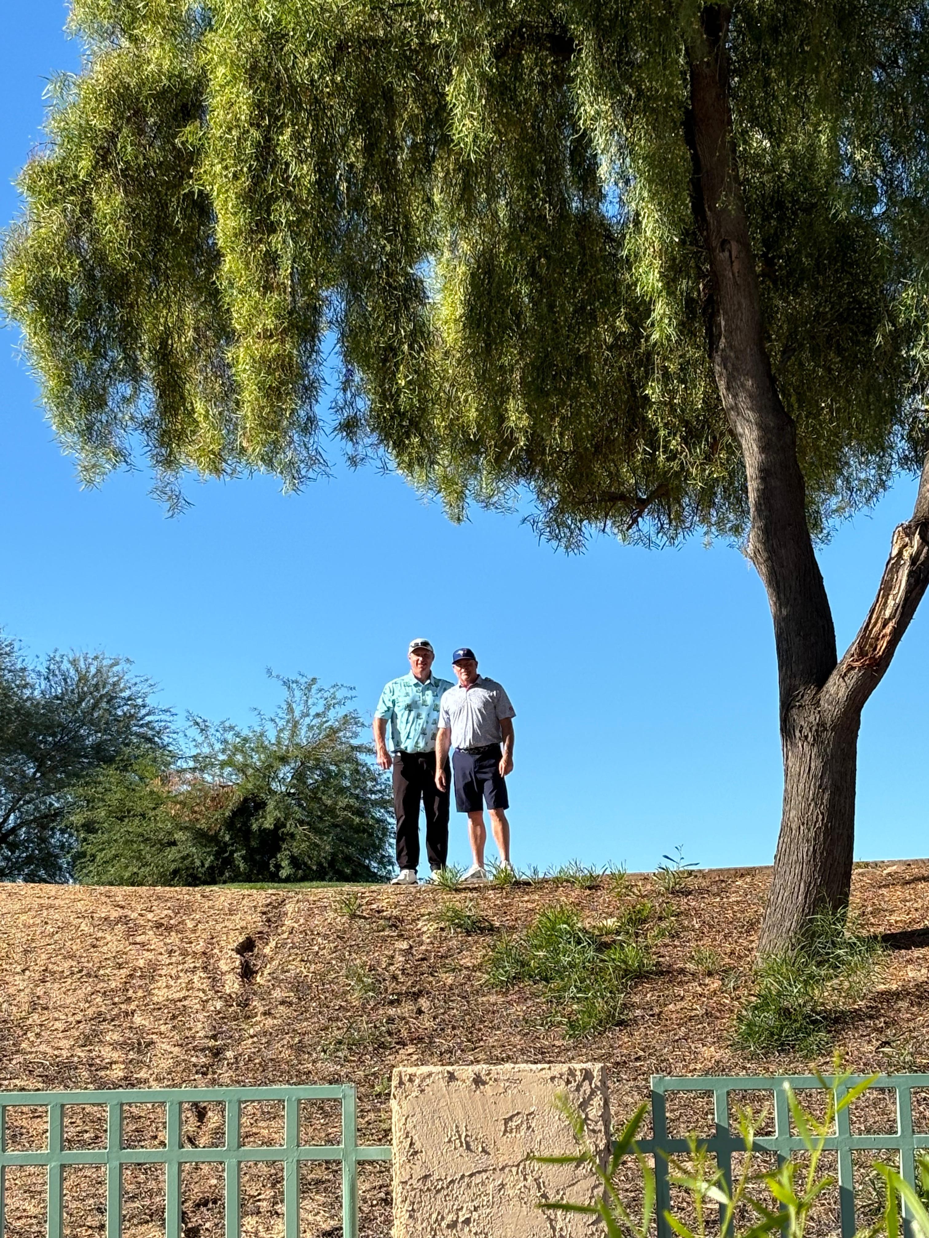 My husband with his buddy golfing. This was taken from the patio. 