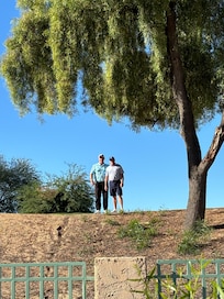 My husband with his buddy golfing. This was taken from the patio.