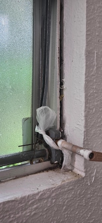 Plastic bag holding window shut