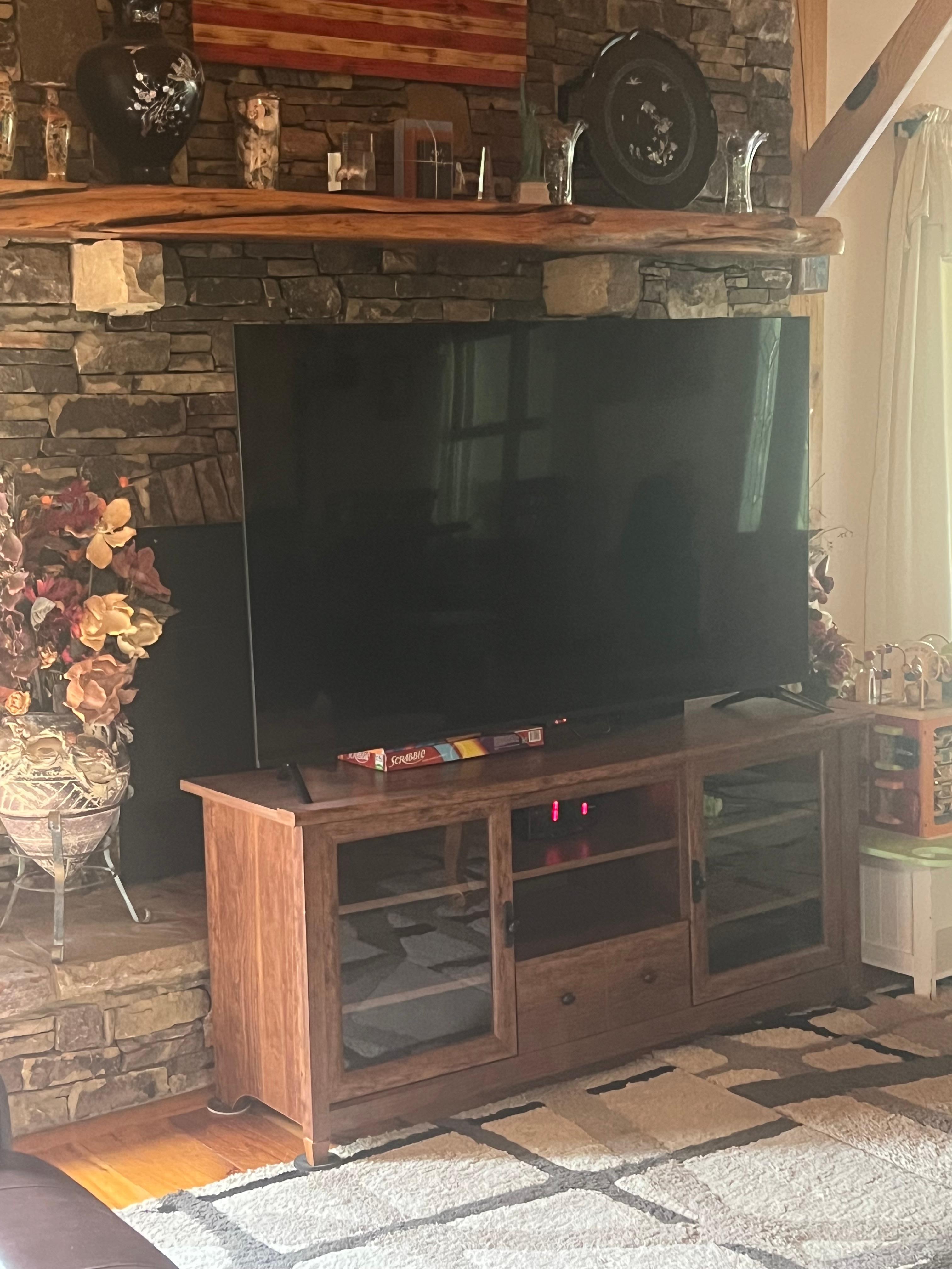 TV blocks fireplace.