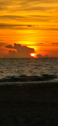 Sunset from beach in front of condos