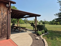 Picnic tables off the pool house