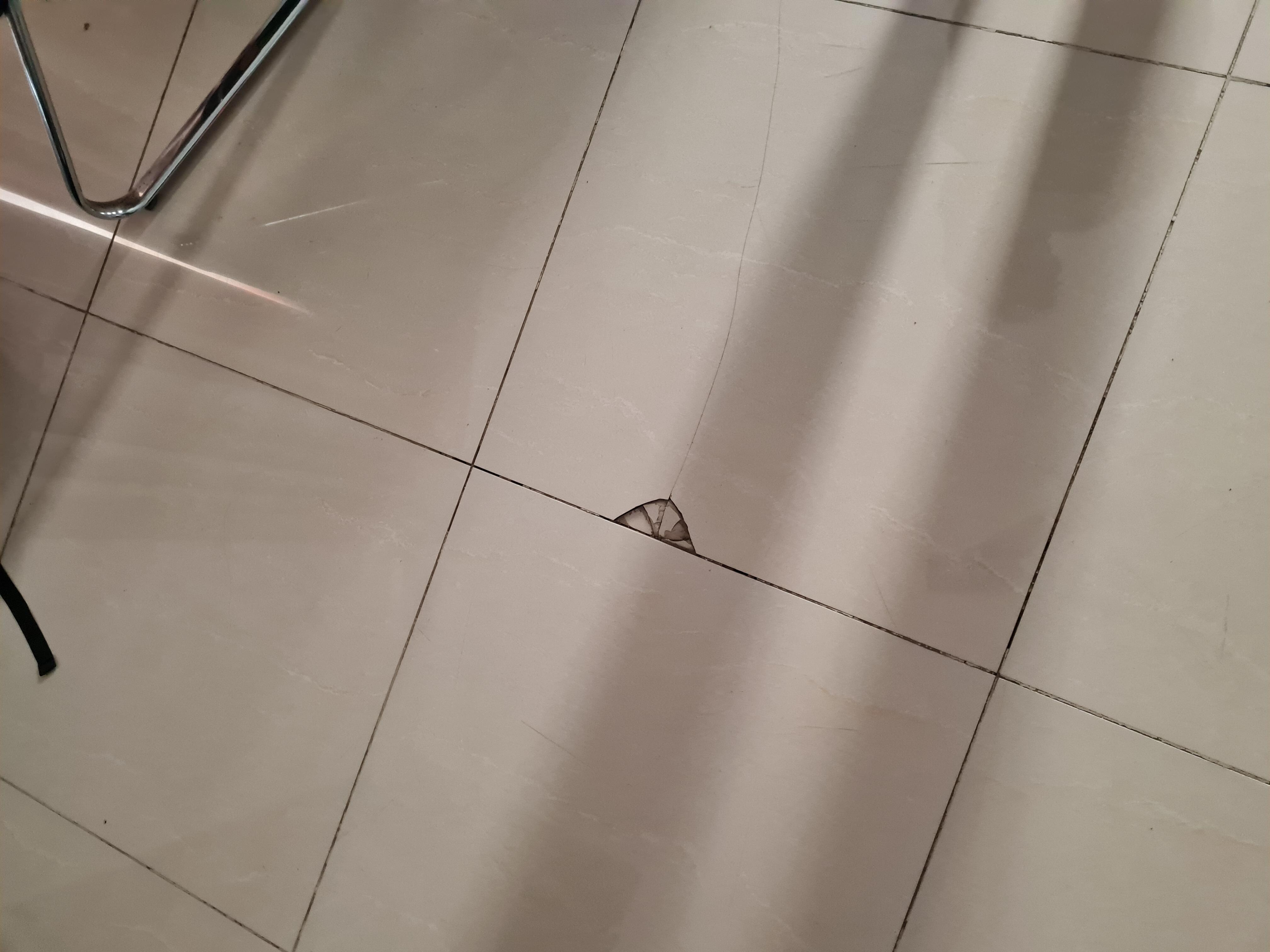 Cracked tiles on floor
