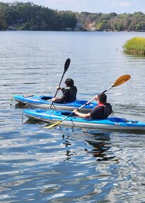 Kids kayaking, having fun.