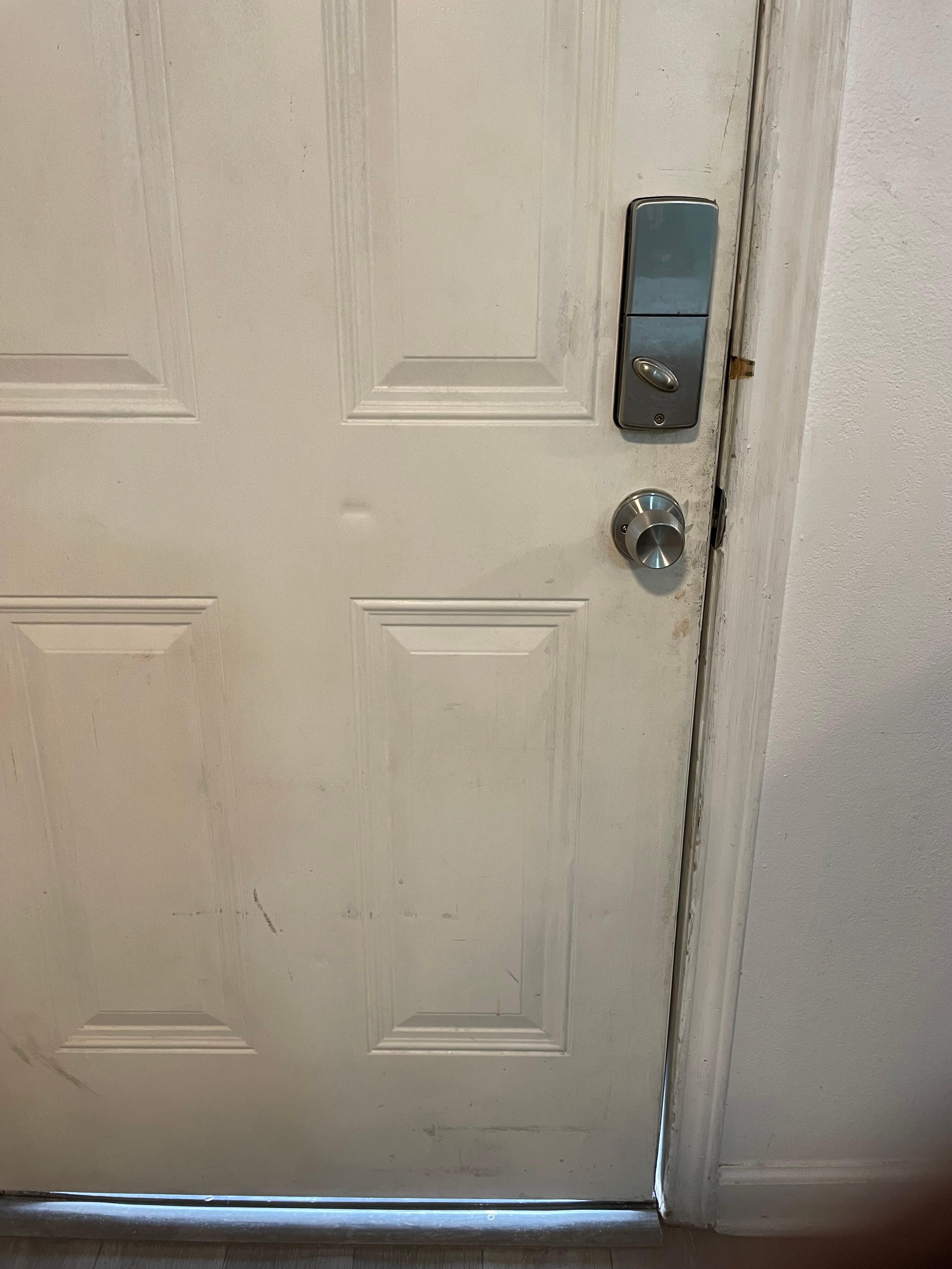Filthy door with huge gap under it allowing bugs in  