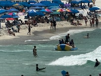 I took this pic of my hubby/boys getting back from parasailing. It’s in-front of the hotel/resort buildings. Just look at that beach! All those umbrellas. It’s packed! I can taste the sunscreen in this pic. Now look back at the pic of our beach. 😍