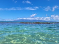 Area between the rocks, clear water, soft sand, not deep