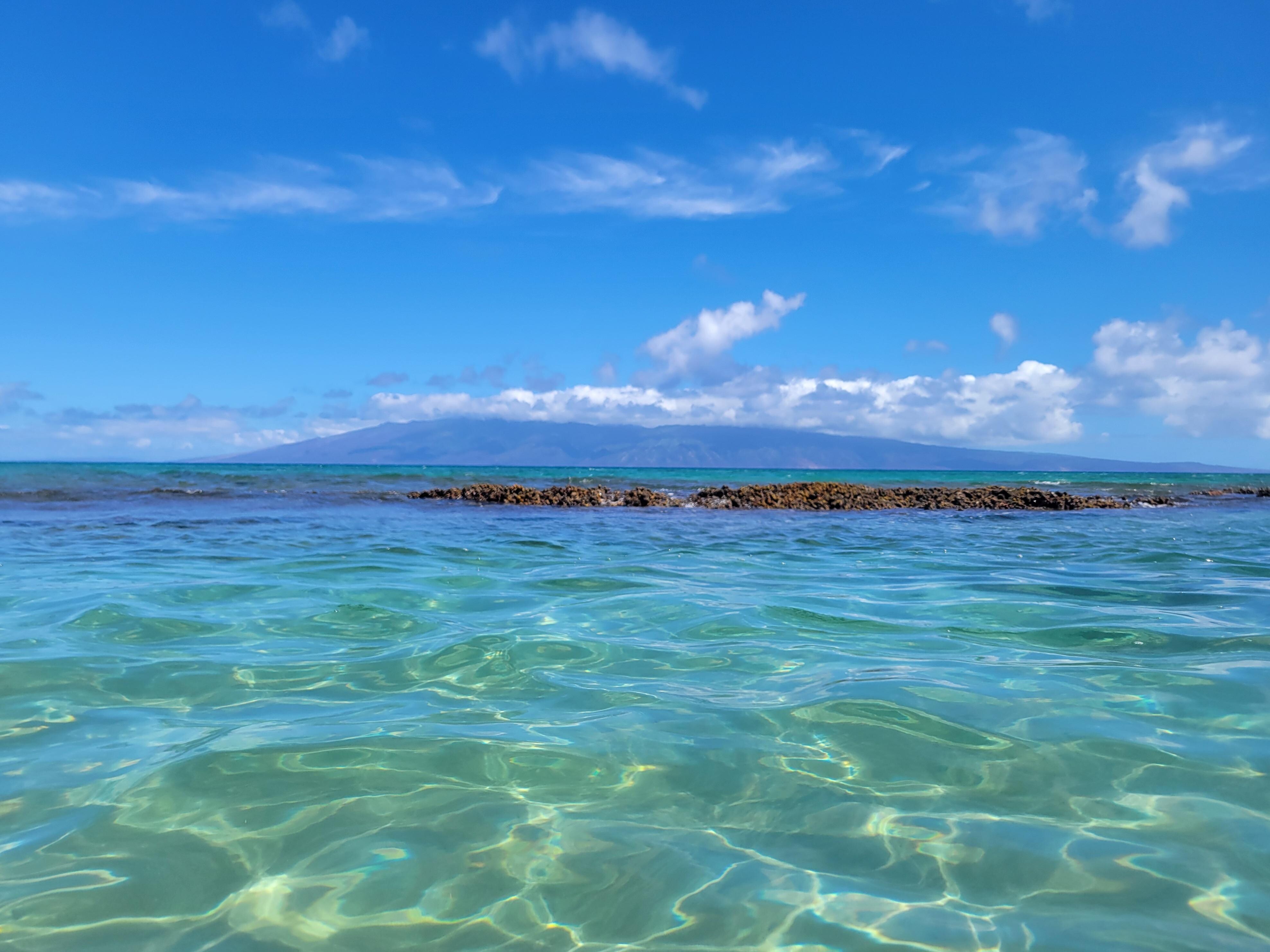Area between the rocks, clear water, soft sand, not deep