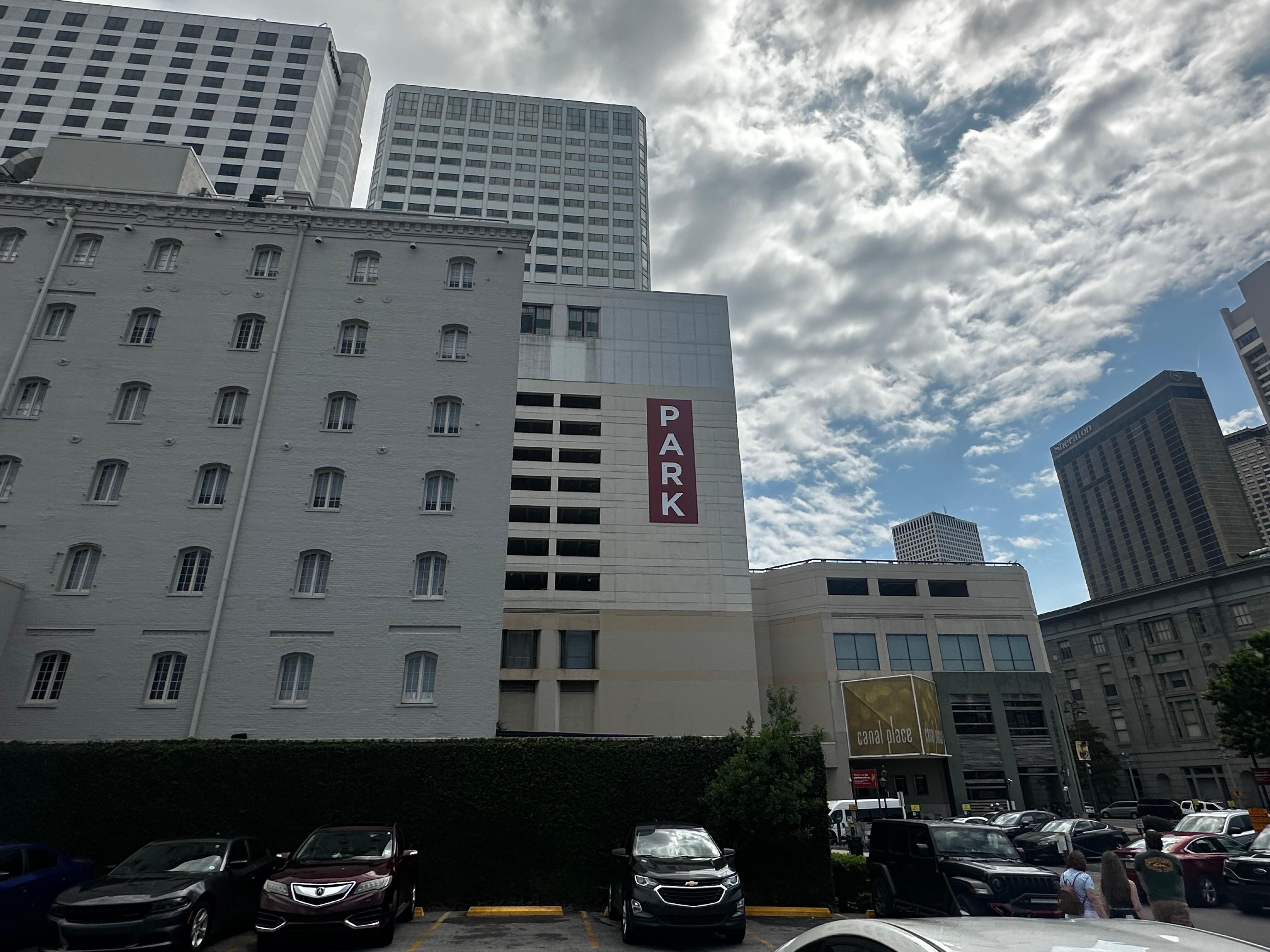 The hotel is the little white building in front of the Westin that shares parking lot with aquarium, hotel ONE11, and anyone in the French quarter visiting the area